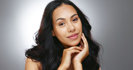 Hair care, woman and face with beauty and fresh salon treatment for glow and shine in studio on...