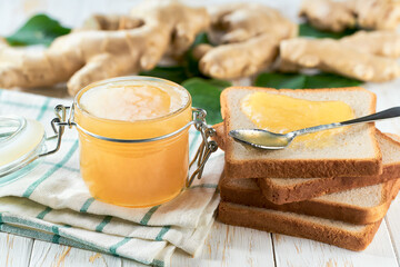 ginger jam sandwiches or toast on light wooden background. Slices of bread with ginger jam for breakfast .
