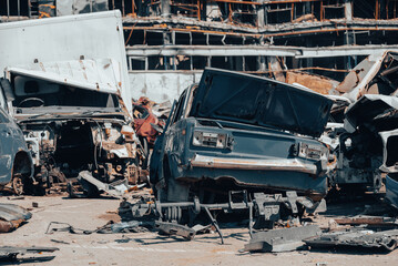 damaged and looted cars in a city in Ukraine during the war