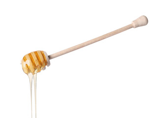 Fresh honey dripping from dipper on white background