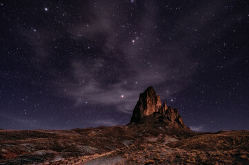 Scenic view of Agathla Peak against the backdrop of a starry sky. Monument Valley, Arizona