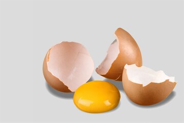 Fresh egg with vitamins and minerals on background