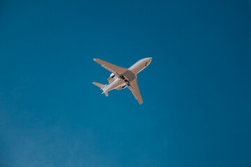 Travel concept. Italy, Lombardy, Milan 1.12.2023. Airplane against blue sky. The plane lands at the Italian airport Linate