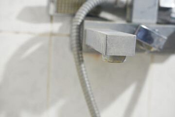 The faucet in the bathroom. Lime scale, close-up. A faucet in a bathroom with lime scale. Small depth of field.