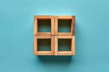 Empty wooden cube on blue background. Top view. Business concept