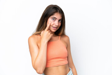 Fototapeta premium Young caucasian woman isolated on white background showing something