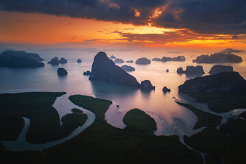 Phang Nga Bay: Ethereal sunrise paints the limestone karsts in a breathtaking display. Thailand.