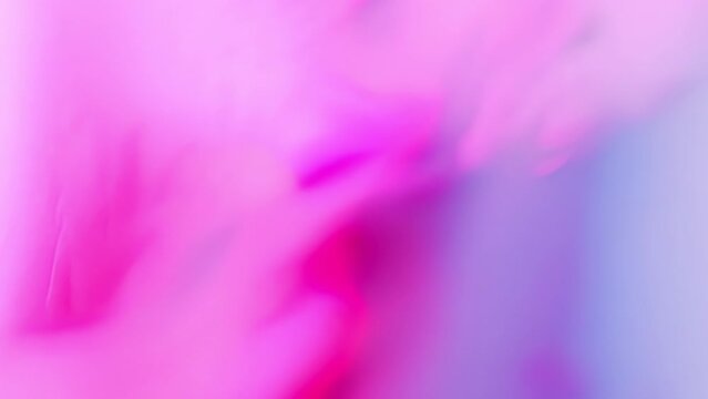 Abstract gradient pink and blue background. Moving colourful paint stains.