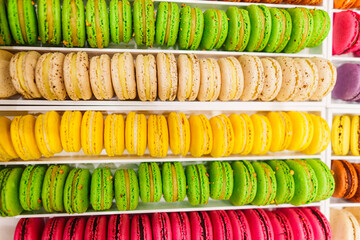 Colorful french macarons background, close up. Tasty sweet color macaroon. Bakery concept.Selective focus.