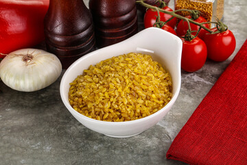 Dry wheat bulgur cereal heap