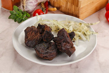 Grilled beef barbecue served onion