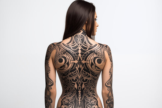 Black tribal tattoo on skin. Black tribal tattoo on back. Women's tattoo, tribal. Tribal tattoo. Tattoo ideas for men. Tattoo parlor. Tattoo artist profession.​