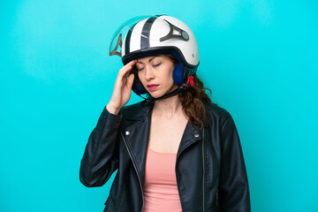 Young caucasian woman with a motorcycle helmet isolated on blue background with headache