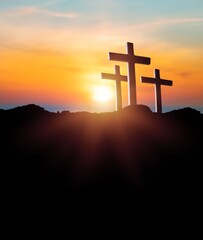 The bright sunset background and wooden cross