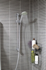 Open shower at home running water, restriction of water consumption and water resources.