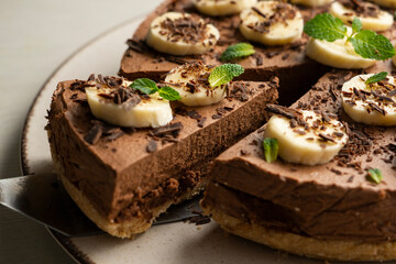 Delicious and fluffy chocolate mousse cake with banana and orange aroma.