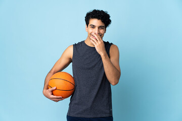 Venezuelan basketball player man over isolated background happy and smiling covering mouth with hand