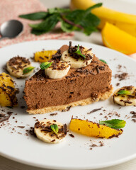 Delicious and fluffy chocolate mousse cake with banana and orange aroma.