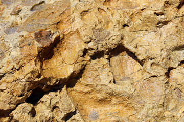 Close-up on rocky rock, stone background.