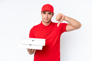 Pizza delivery caucasian man with work uniform picking up pizza boxes isolated on white background...