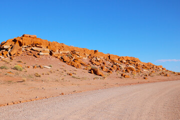 Fototapeta na wymiar An empty sand road in the desert of the United States