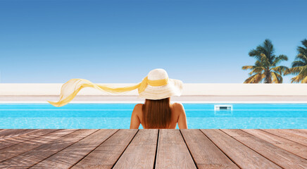 Fototapeta na wymiar Young woman sunbathing at the tropical resort