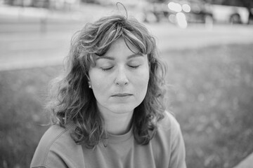 Face, smile and portrait of a woman with eyes closed in summer in the city park for beauty, confident in nature. female person or model outdoor with freedom, happiness, style. High quality photo