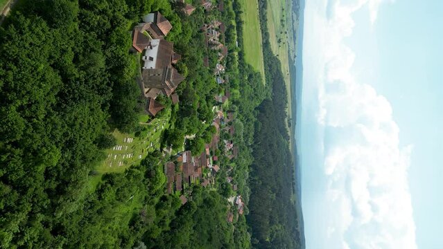 Beautiful and traditional Viscri Village. Viscri is only one of the Saxon villages of Transylvania. View of his main attractions, The Fortified Church and cemetery. In background is the village.