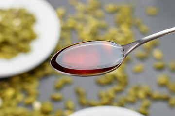 Organic pumpkin seed oil in spoon. Natural nutritious ingredient