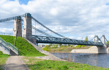 Fototapeta premium Unique Chain Bridges over the Velikaya River. Suspension bridge over the Velikaya River in the city of Ostrov. Pskov region. Russia