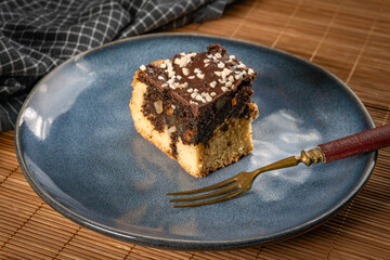 A piece of cake with poppy seeds.