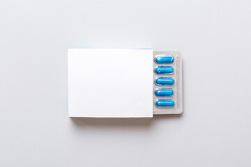 Blank White Product Package Box Mock-up. Open blank medicine drug box with blue pills blister top view - obrazy, fototapety, plakaty
