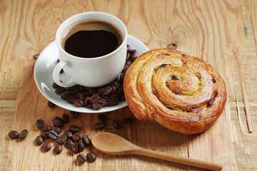 Coffee and raisins puff pastry roll