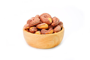 Roasted cashew nuts in wooden bowl isolated on white background