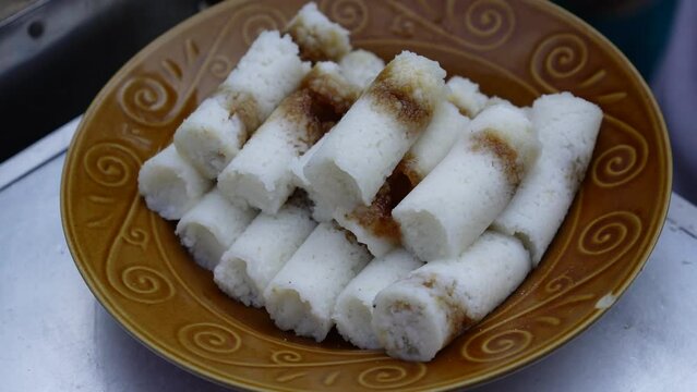 Kue putu or putu bambu, putu buluh or puto bumbongis a traditional cylindrical shaped and green colored steamed cake.