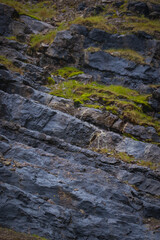 wet black rocks in a rainy day 