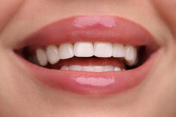 Woman with beautiful lips smiling, closeup view