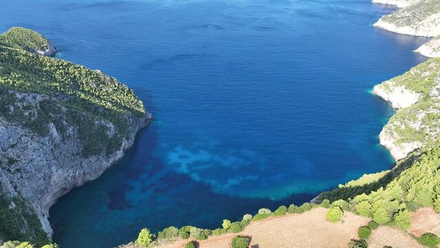 Drone viewpoint of Cliffs of Kambi in Zakinthos Greece Island. Beautiful cliff coast on greek island. Wild cliffs of the western Zakynthos. Vacation turquoise sea and green rock cliffs on the island. 