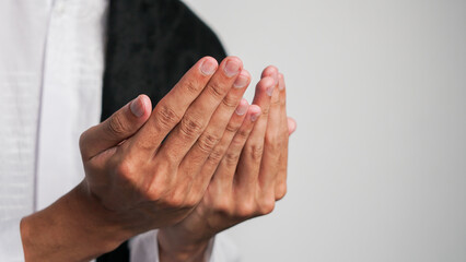 close up of man's hands praying