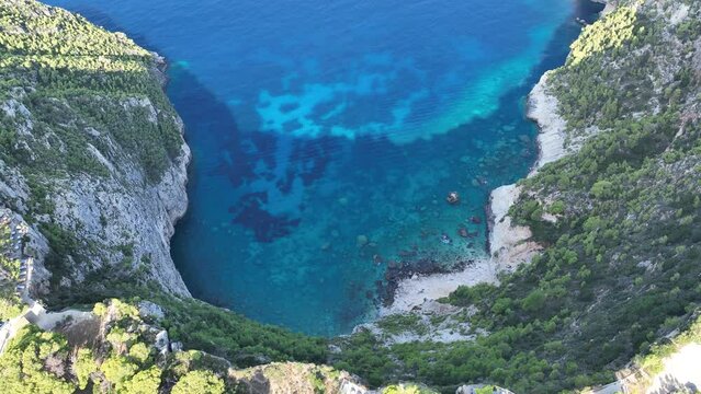 Drone viewpoint of Cliffs of Kambi in Zakinthos Greece Island. Beautiful cliff coast on greek island. Wild cliffs of the western Zakynthos. Vacation turquoise sea and green rock cliffs on the island. 