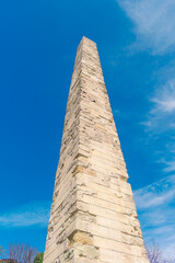 Obelisk of Constantine in Istanbul. An ancient obelisk against the blue sky.