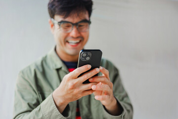 man using cell phone hand holding mobile texting message contact us.chatting,search internet information.technology device communication connecting