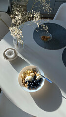 Top view of white dinning table with cereal for breakfast - 733840400
