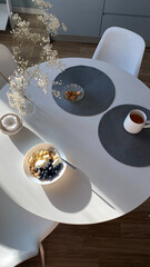 Top view of white dinning table with cereal for breakfast - 733840425