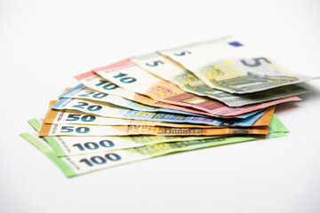 Obraz na płótnie Canvas Pile of euro banknotes of 100, 50, 20, 10 and 5 euros. White background