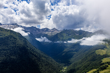 Naklejka premium Summer landscape and clouds in Bagneres Luchon in Pyrenees, France