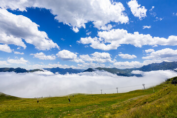 Fototapeta na wymiar Summer landscape and clouds in Bagneres Luchon in Pyrenees, France