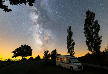 MIlky way and motorhome camper in Serra Del Cadi, Pyrenees, Spain