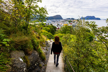 Young woman in Alesund city from view point, Norway, Europe