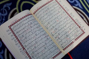 Quran, Al Qur'an, Islamic background for Eid al-Fitr Eid al-Adha. Open page of Al-Quran. Islamic concept